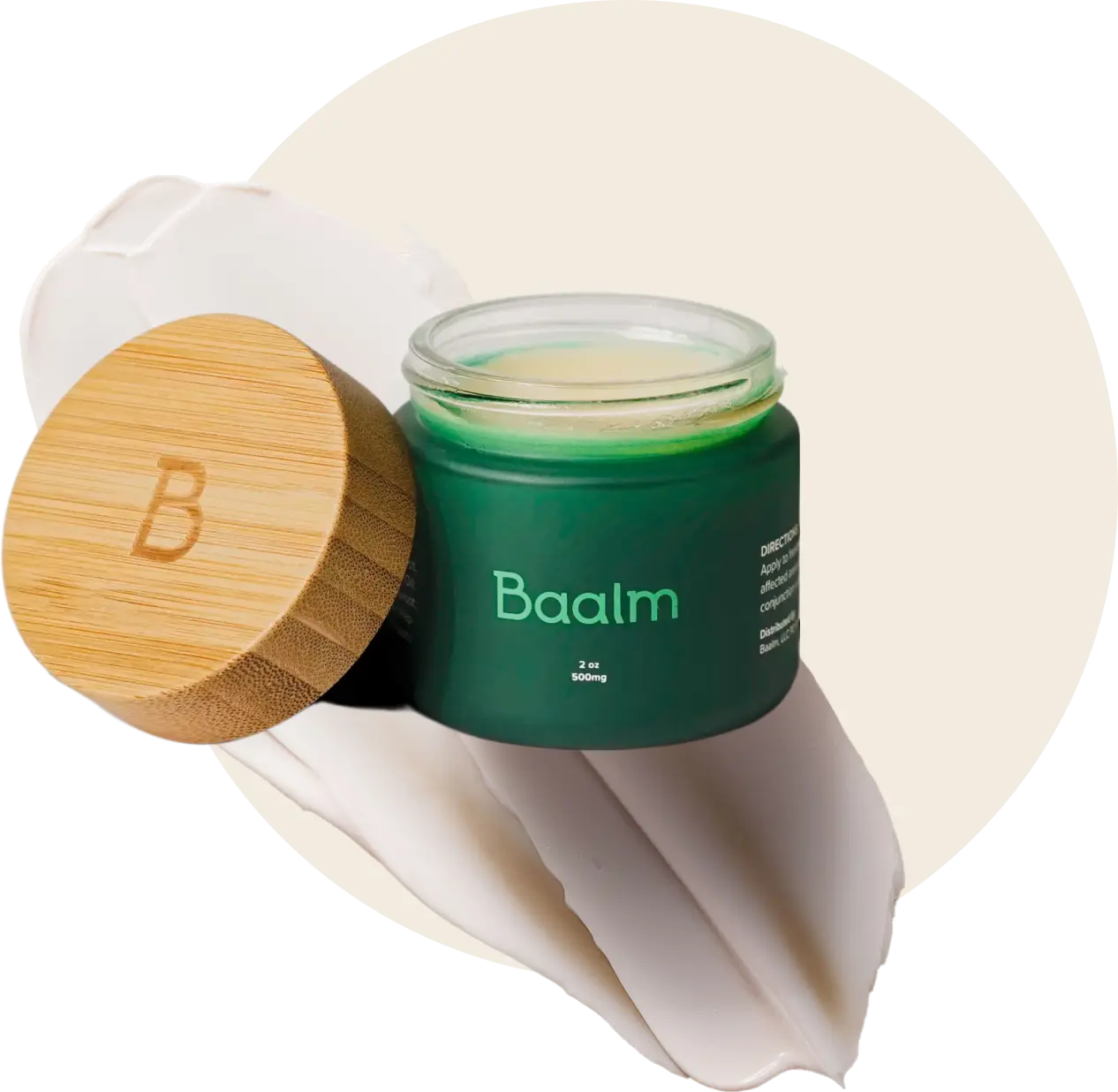 An open container of Baalm with the bamboo lid leaning on the left side and a streak of cream in the background.